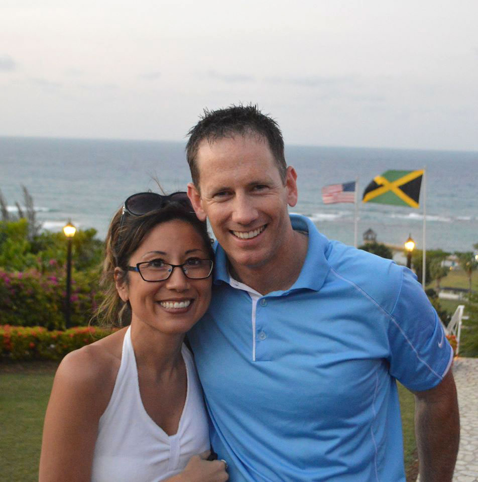 Chris Roberts with wife on a beach
