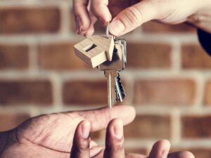 A landlord handing over keys to the property